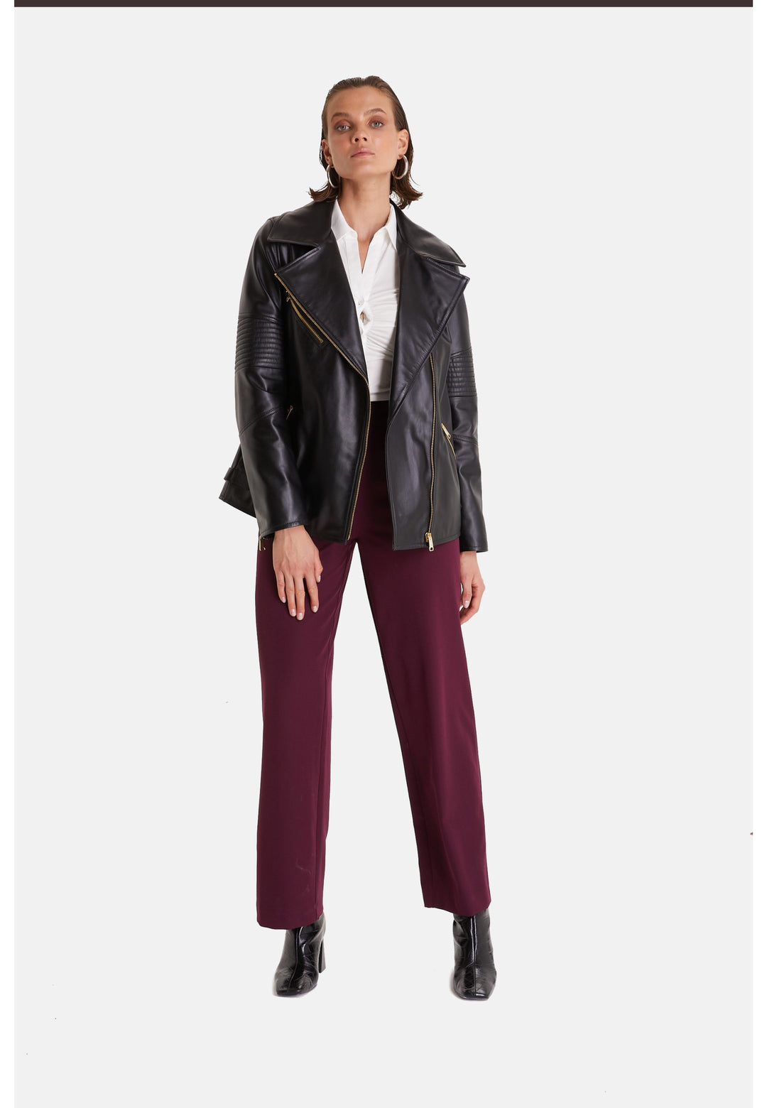 Woman wearing black leather biker jacket