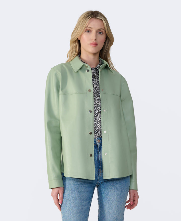 Sage green leather shirt jacket on model
