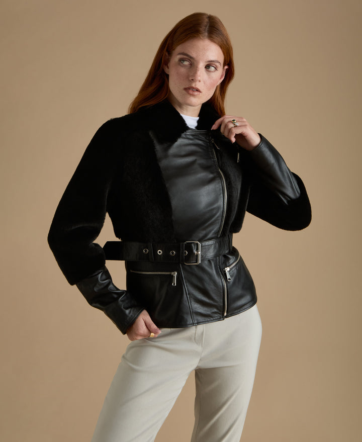 Woman wearing black leather jacket