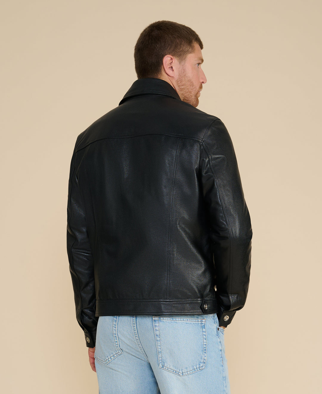 Black leather jacket back view