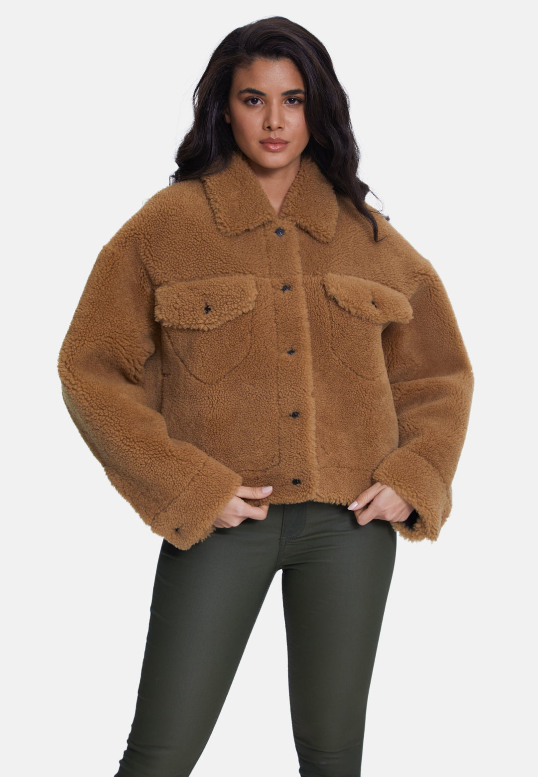 Woman wearing brown teddy jacket