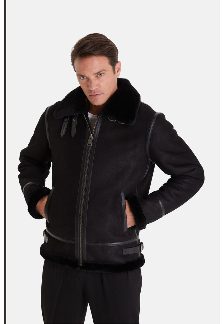 Man wearing black sheepskin aviator jacket