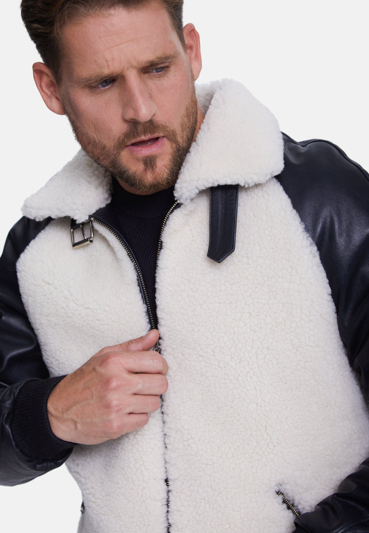 Man wearing white shearling jacket