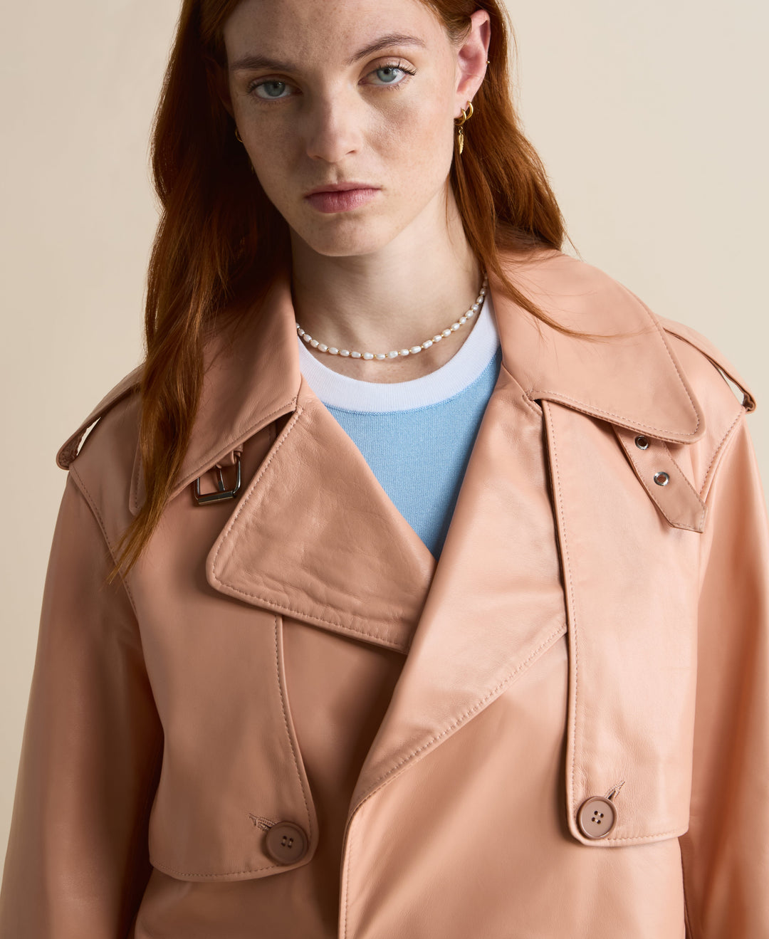Peach leather trench-style jacket on model