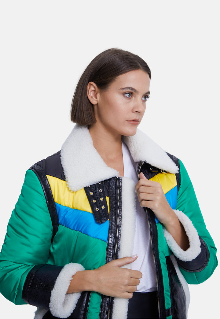 Woman wearing colorblock sheepskin coat