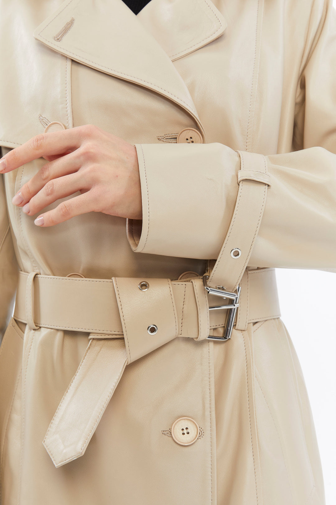 Beige leather trench coat close-up