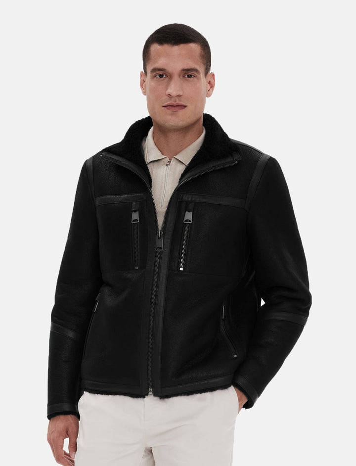 Male model wearing black sheepskin coat