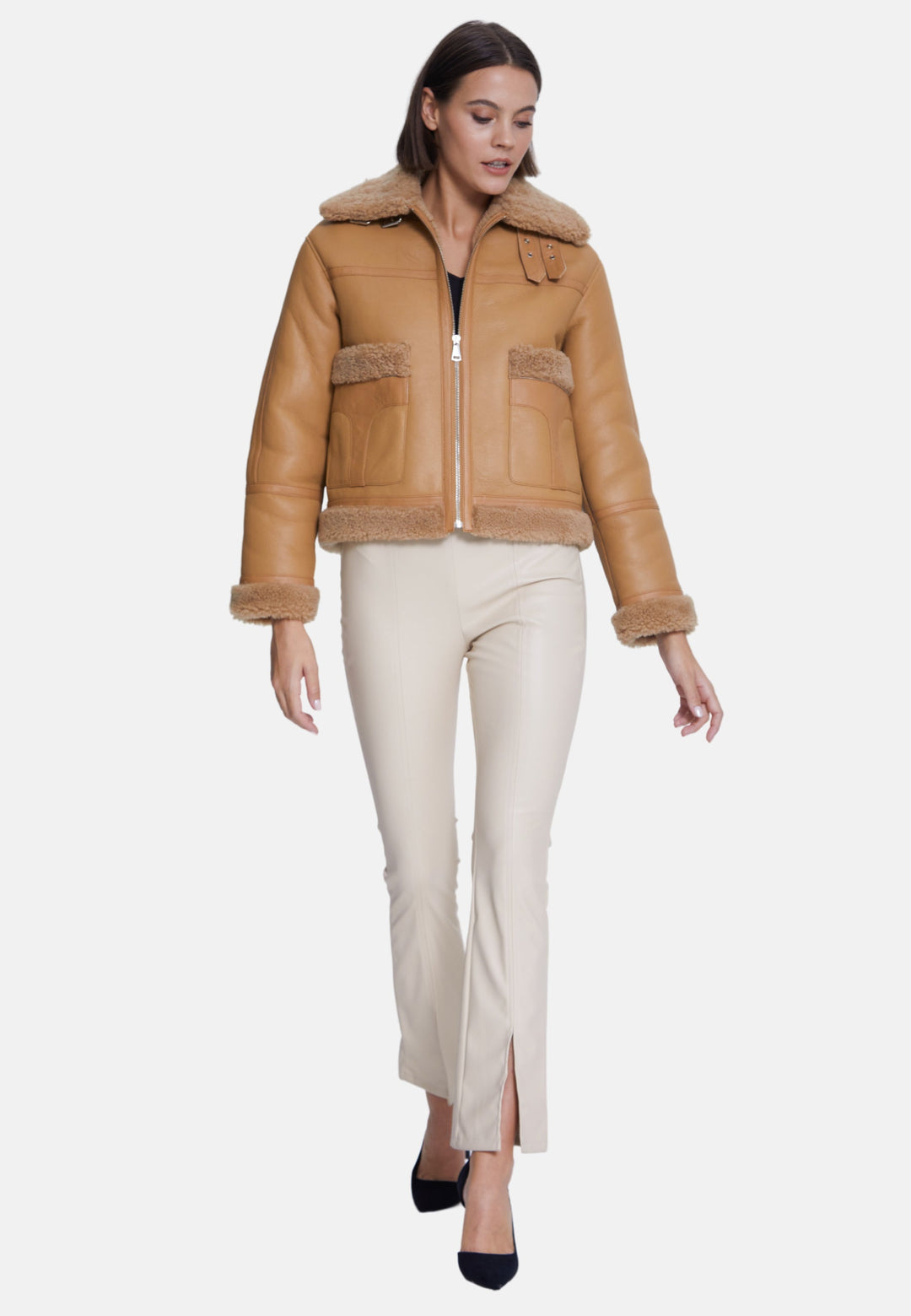 Woman wearing beige sheepskin jacket