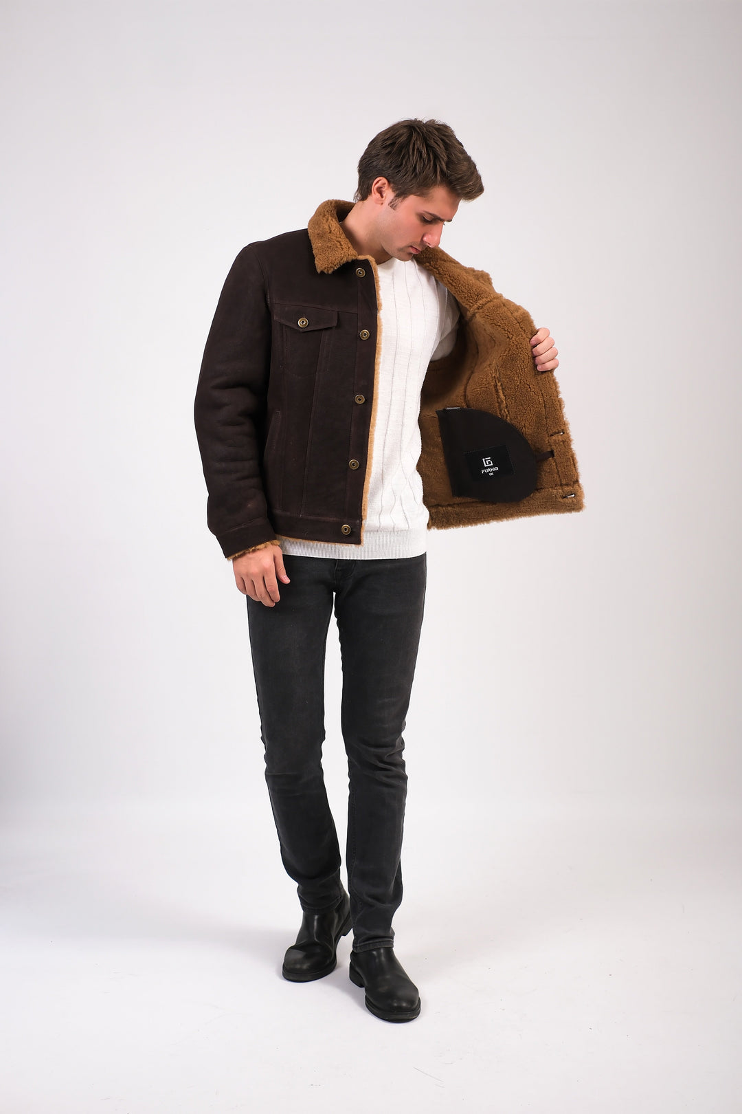 Man wearing brown shearling jacket