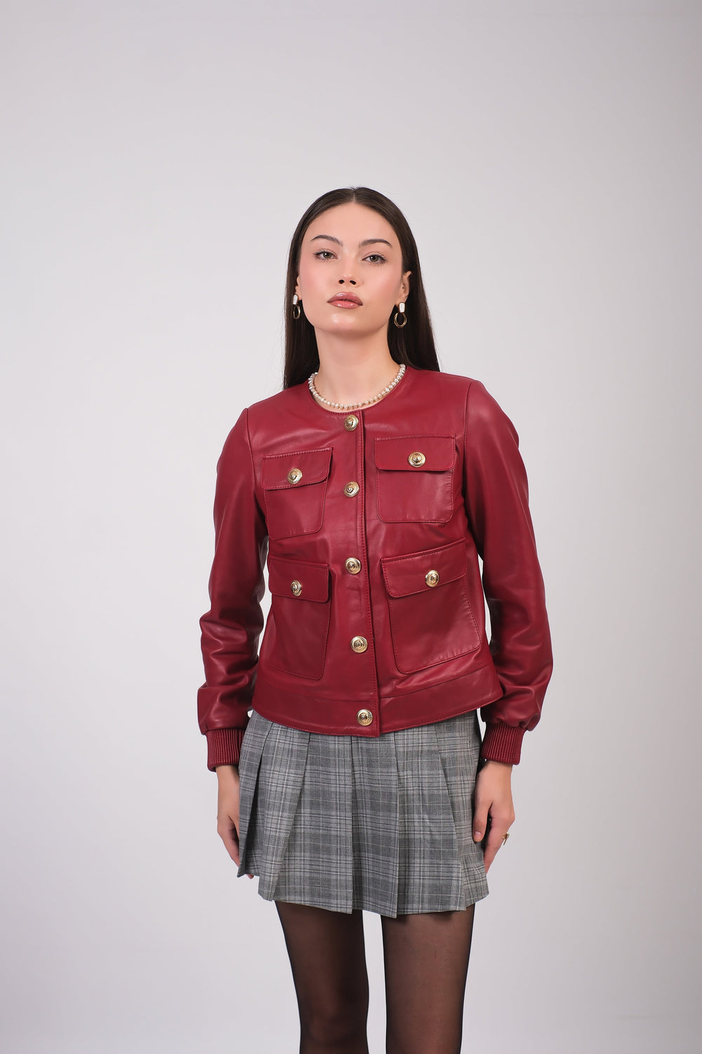 Woman wearing burgundy leather jacket