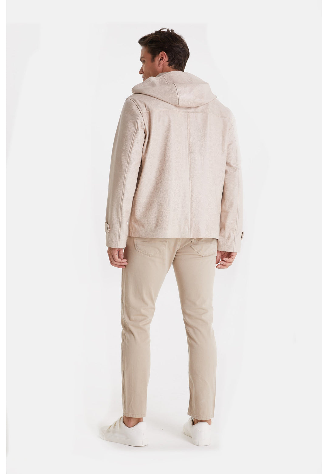 Man wearing beige hooded leather jacket