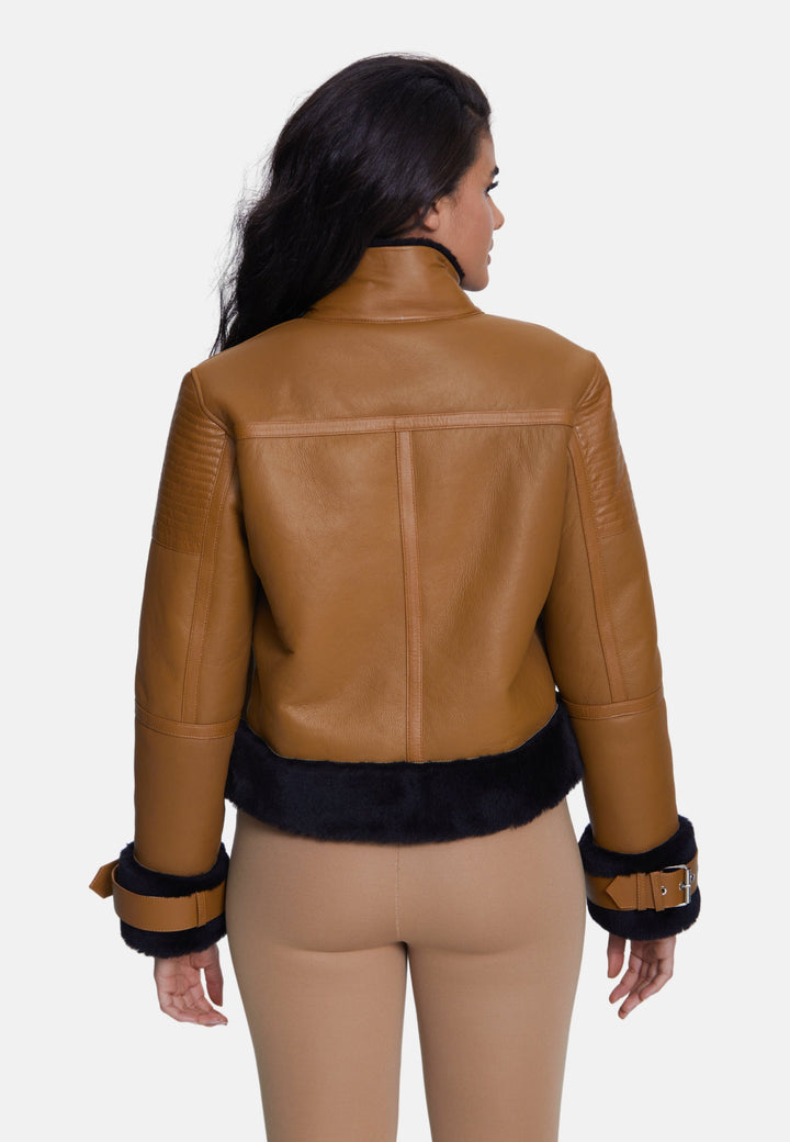 Woman wearing tan sheepskin jacket