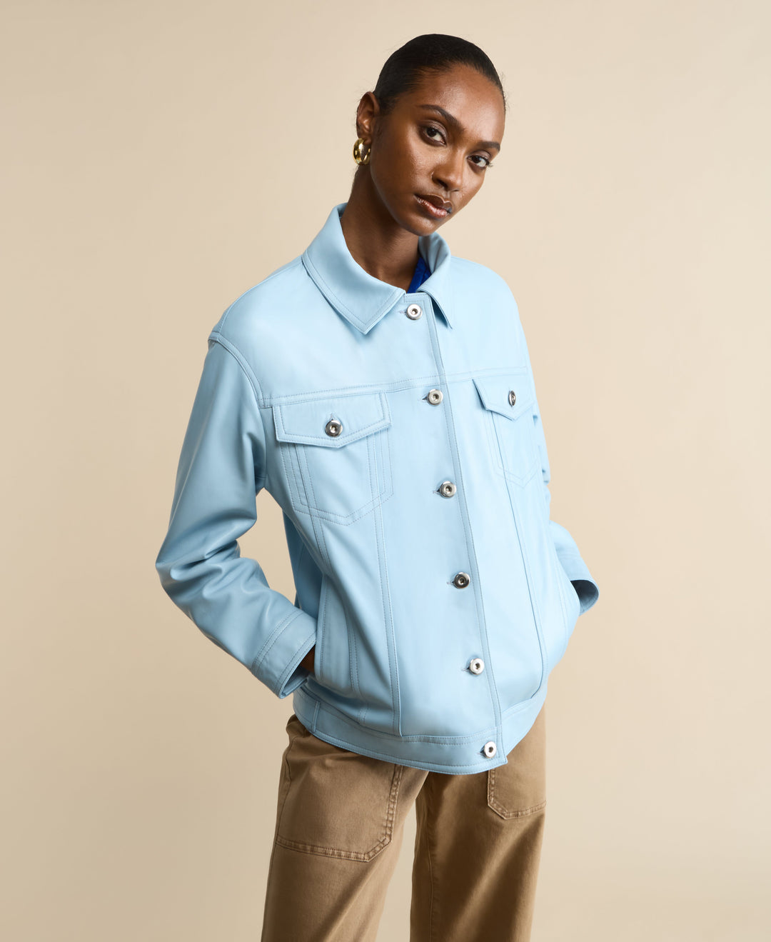 Light blue leather shirt jacket on model