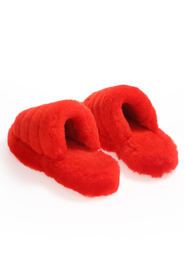 Pair of red shearling slippers