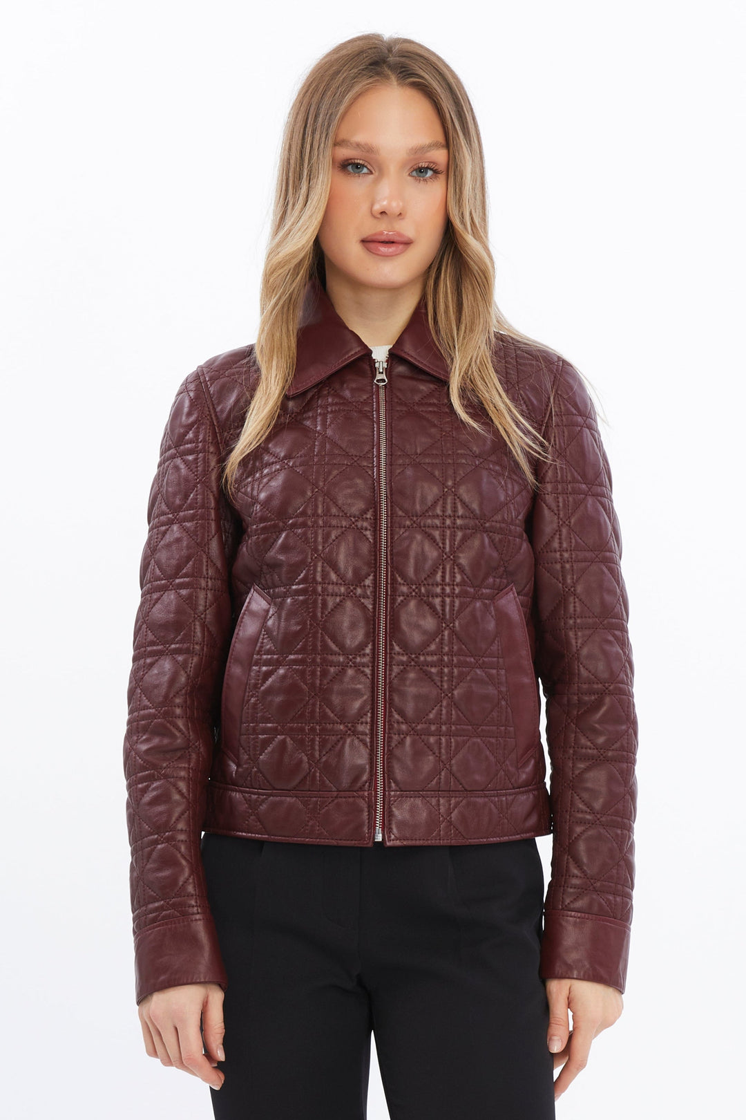 Woman wearing burgundy quilted leather jacket