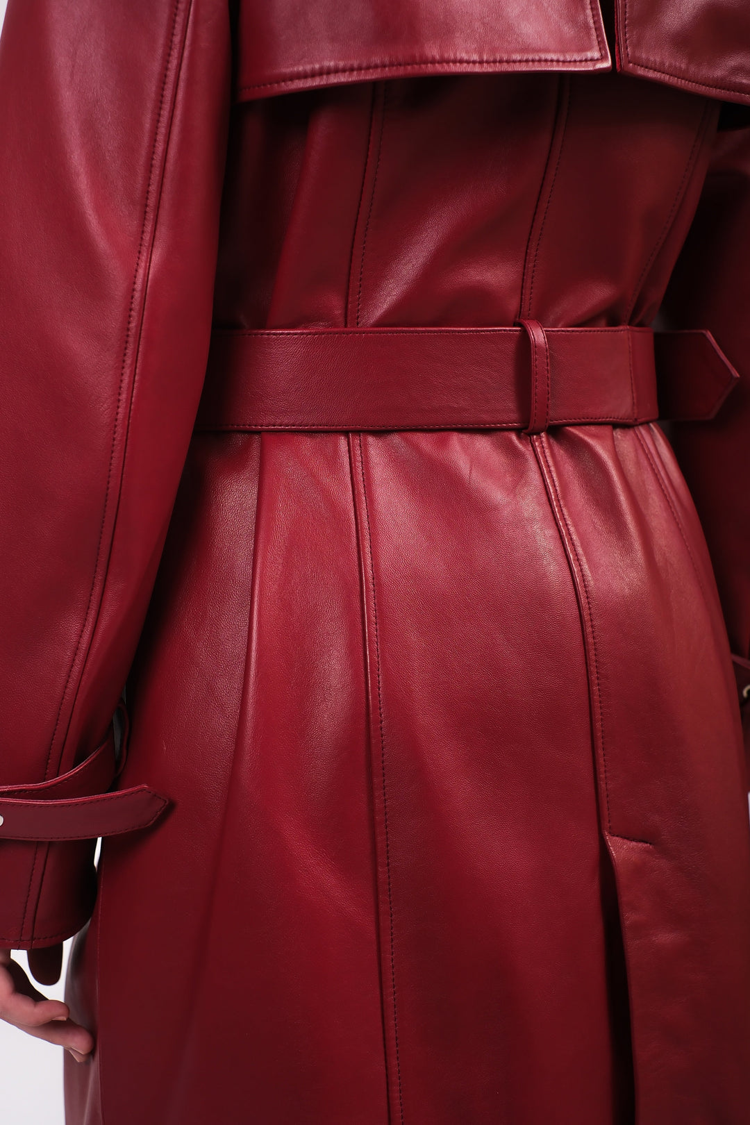 Red leather trench coat back close-up