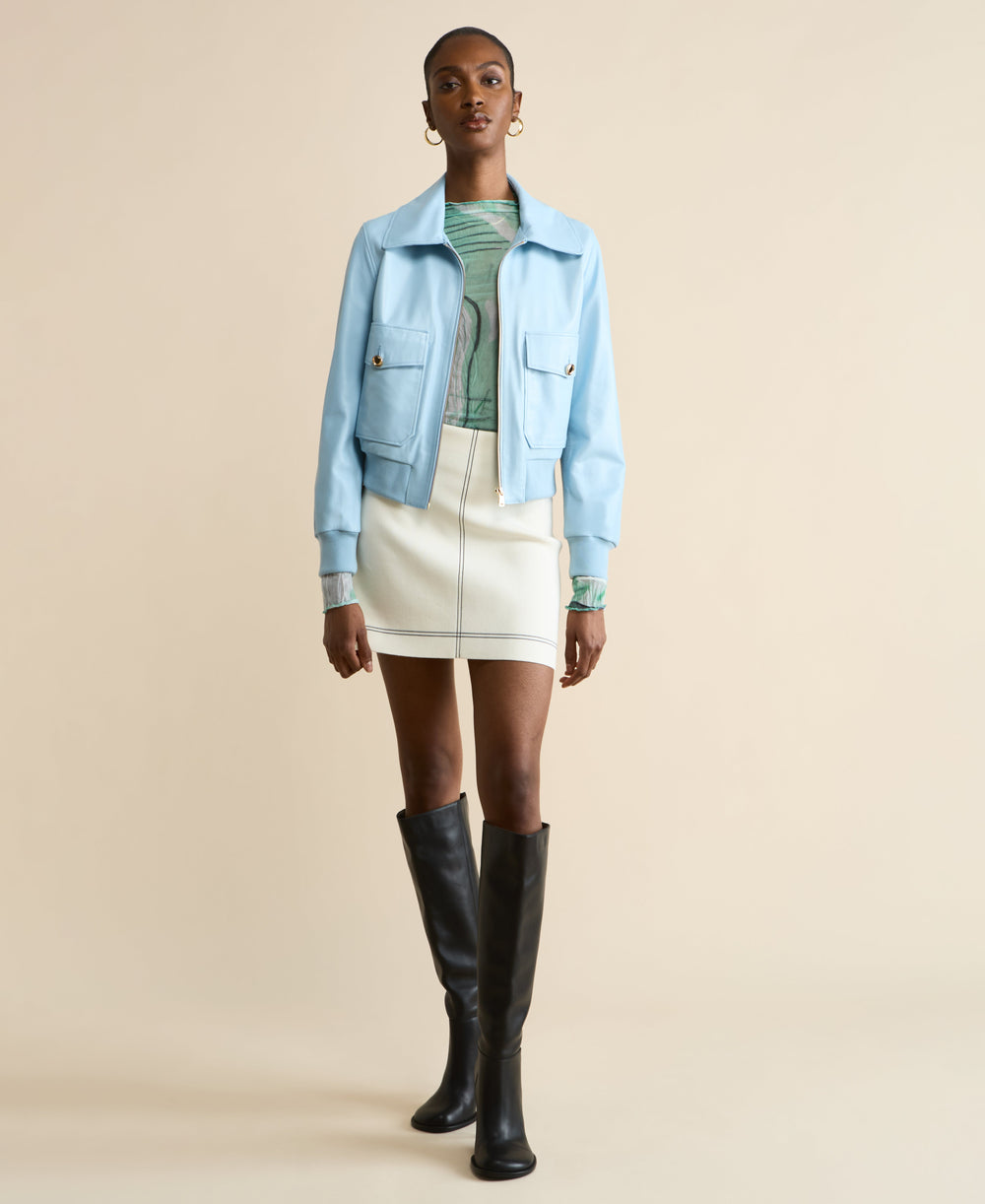 Light blue leather bomber jacket on model