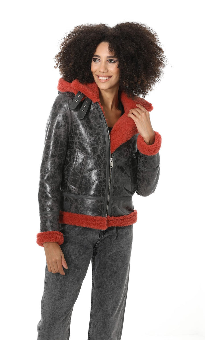 Black distressed shearling jacket with red trim