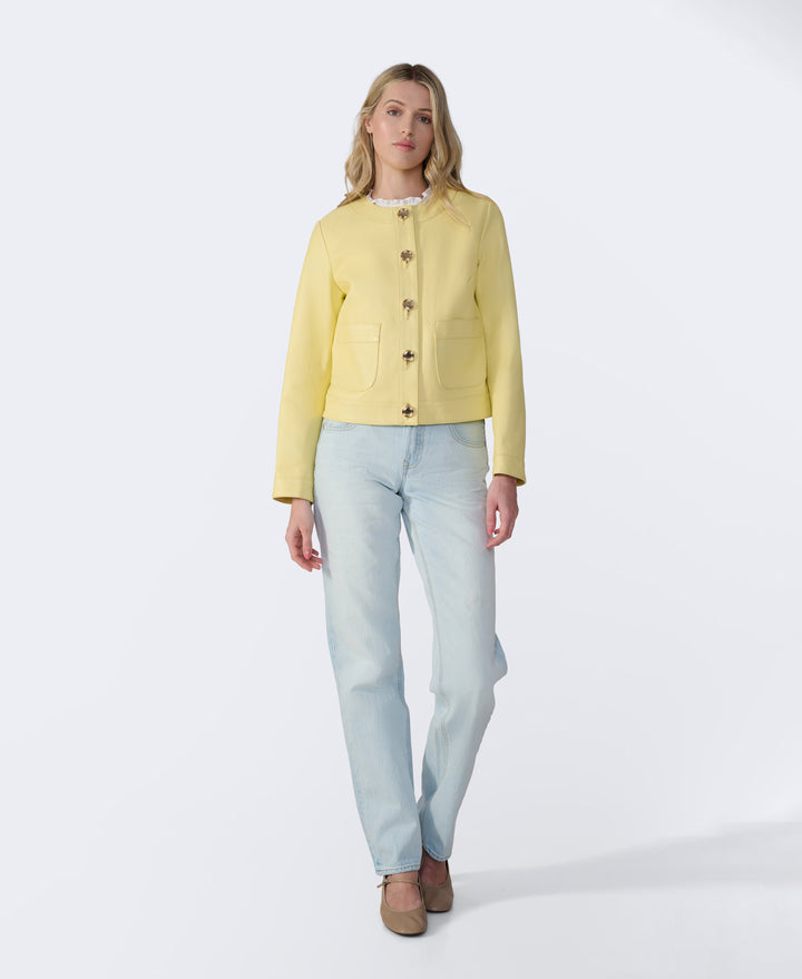 Woman wearing yellow leather jacket