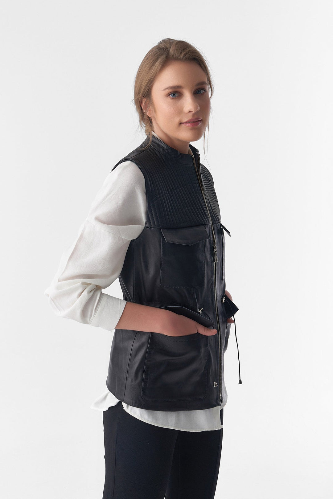 Woman wearing black leather vest