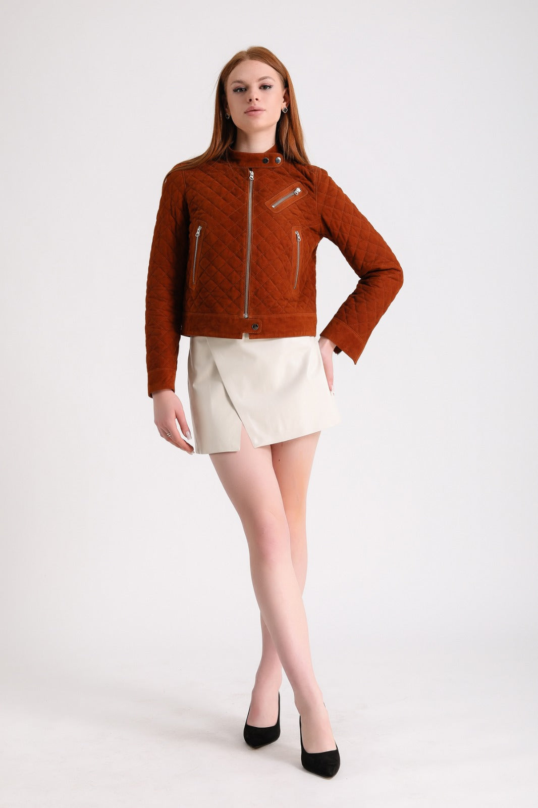 Woman wearing rust quilted suede jacket