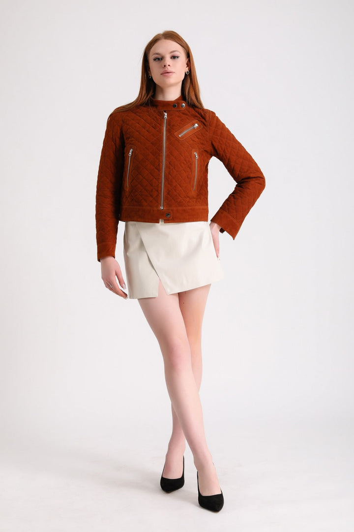 Woman wearing rust quilted suede jacket