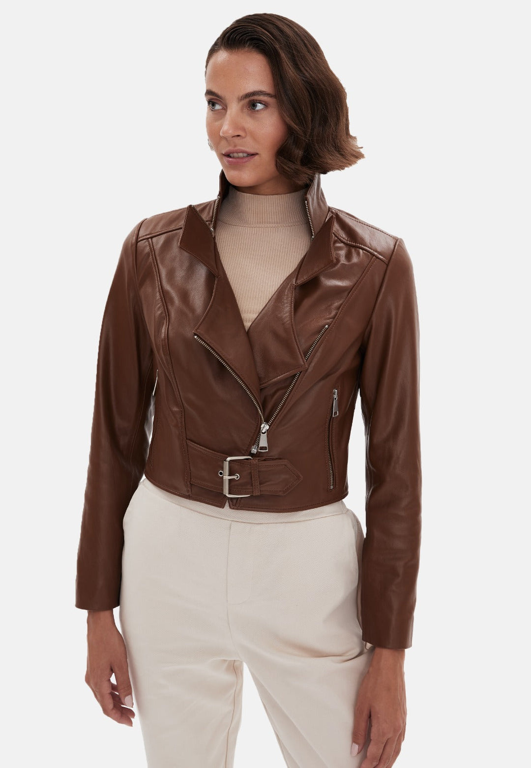 Woman wearing brown cropped leather jacket