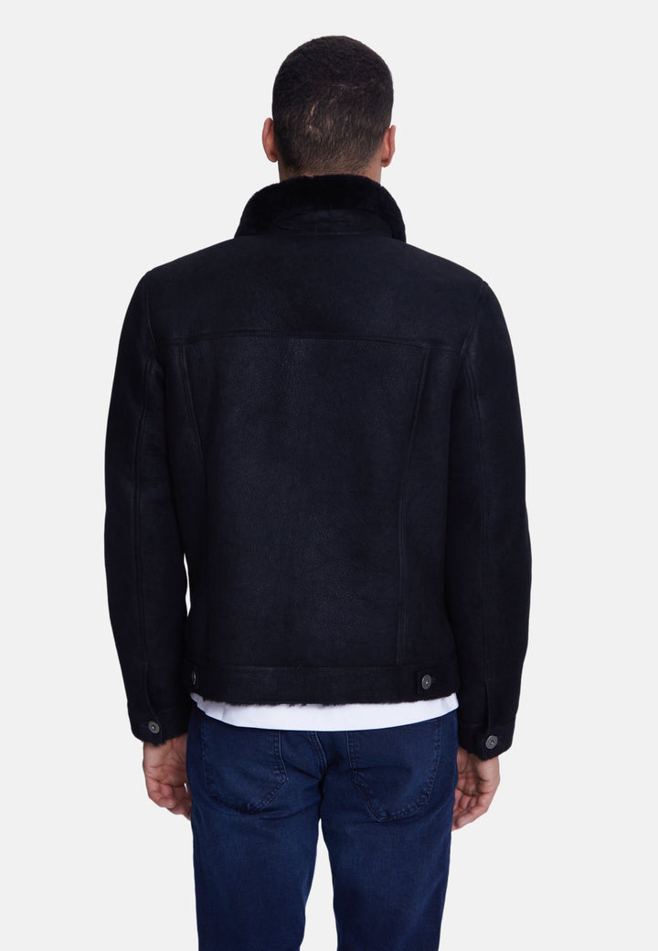 Man wearing black suede jacket (back)