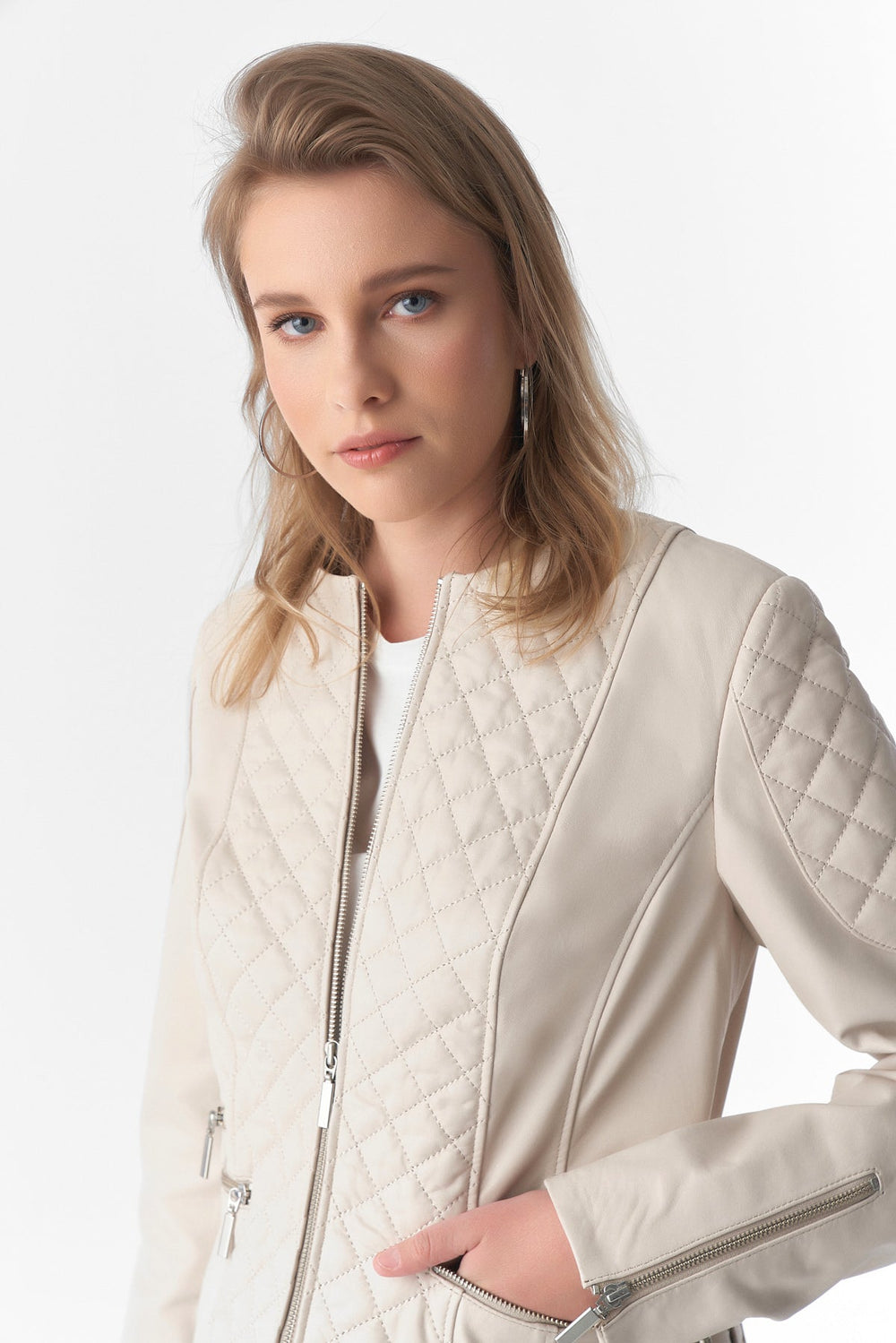 Beige quilted leather jacket on model