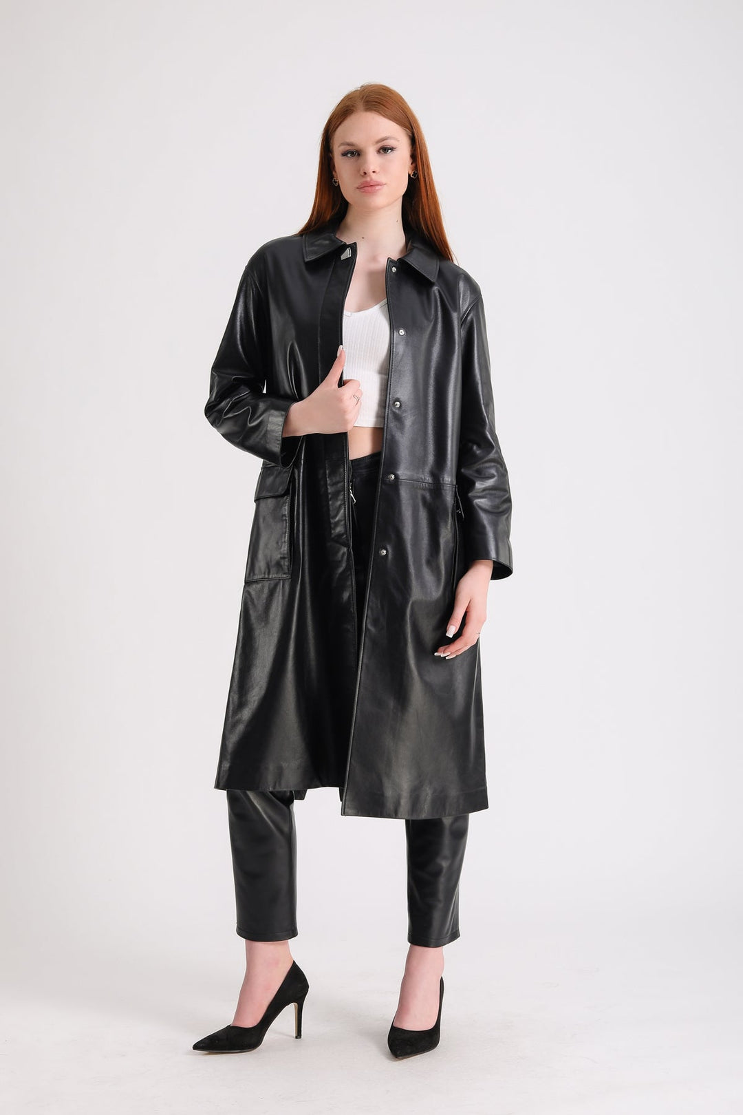 Woman wearing black leather trench coat
