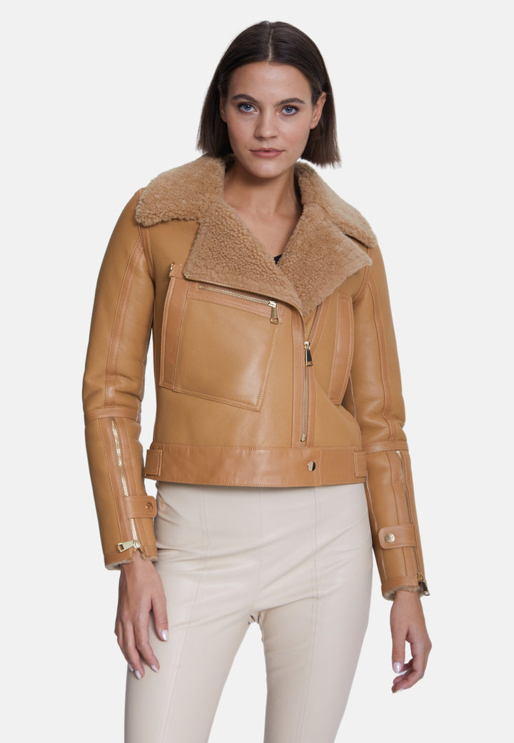 Woman wearing beige shearling jacket