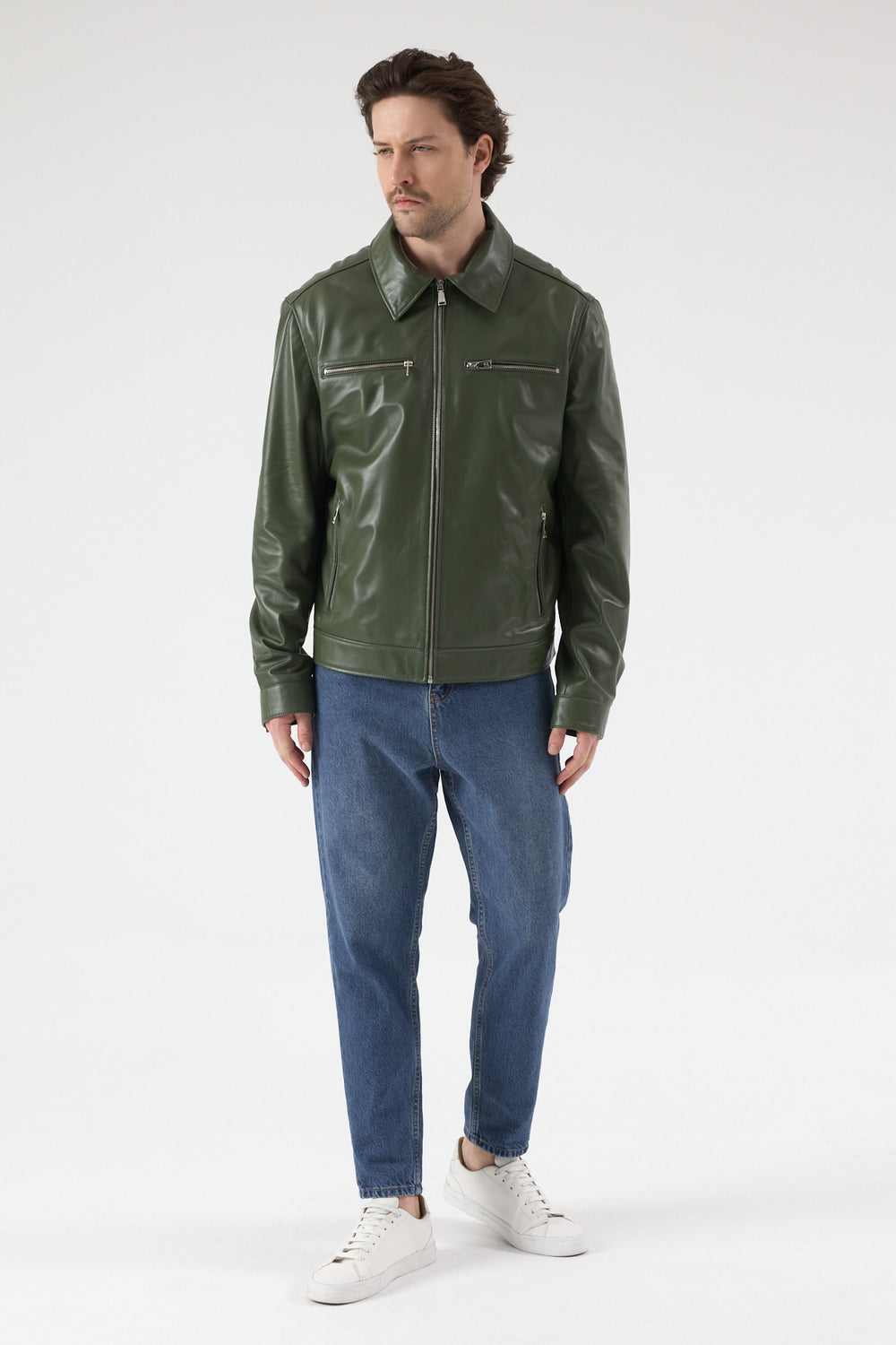 Men’s khaki leather jacket walking pose, premium British leather jacket, modern fit with zip pockets, casual styling