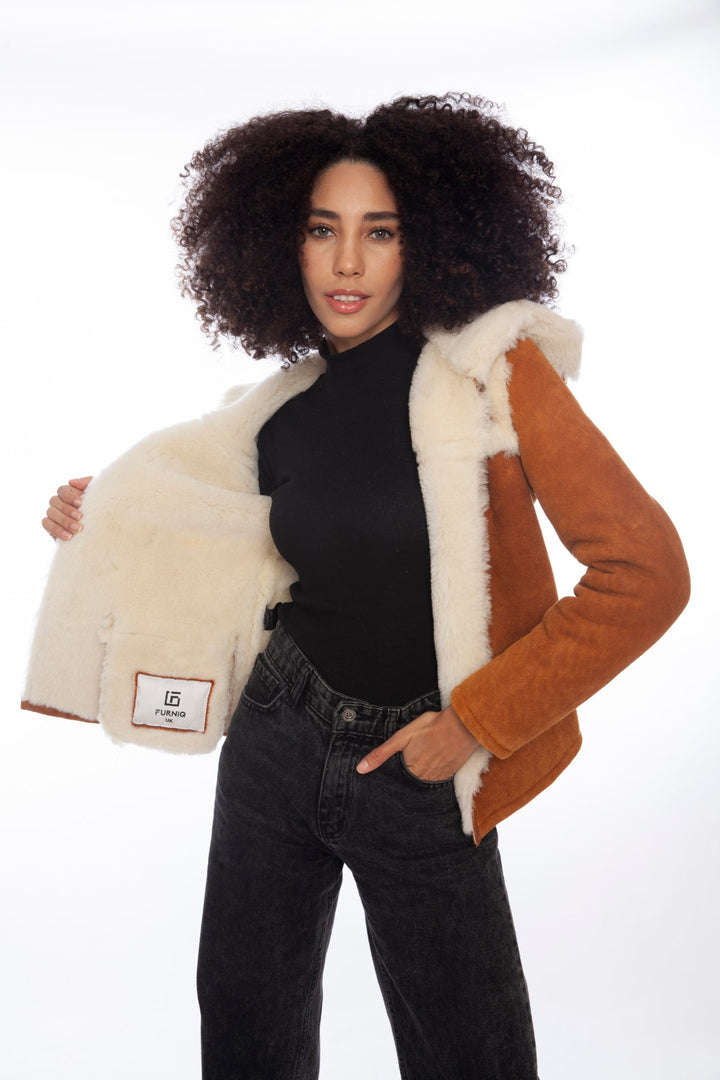 Woman wearing tan sheepskin jacket