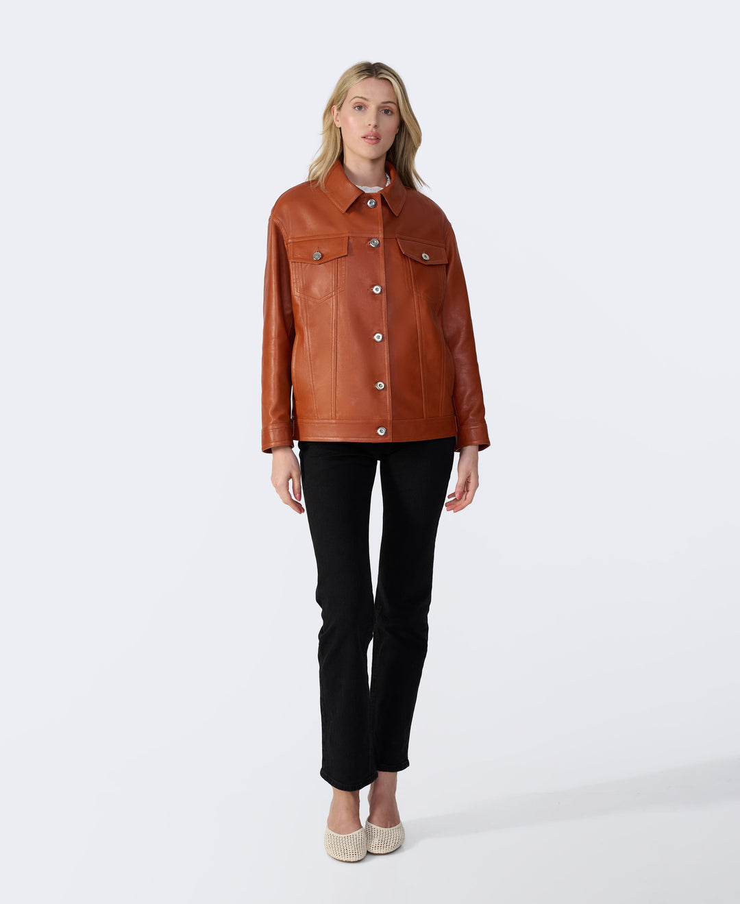 Woman in cognac leather shirt jacket