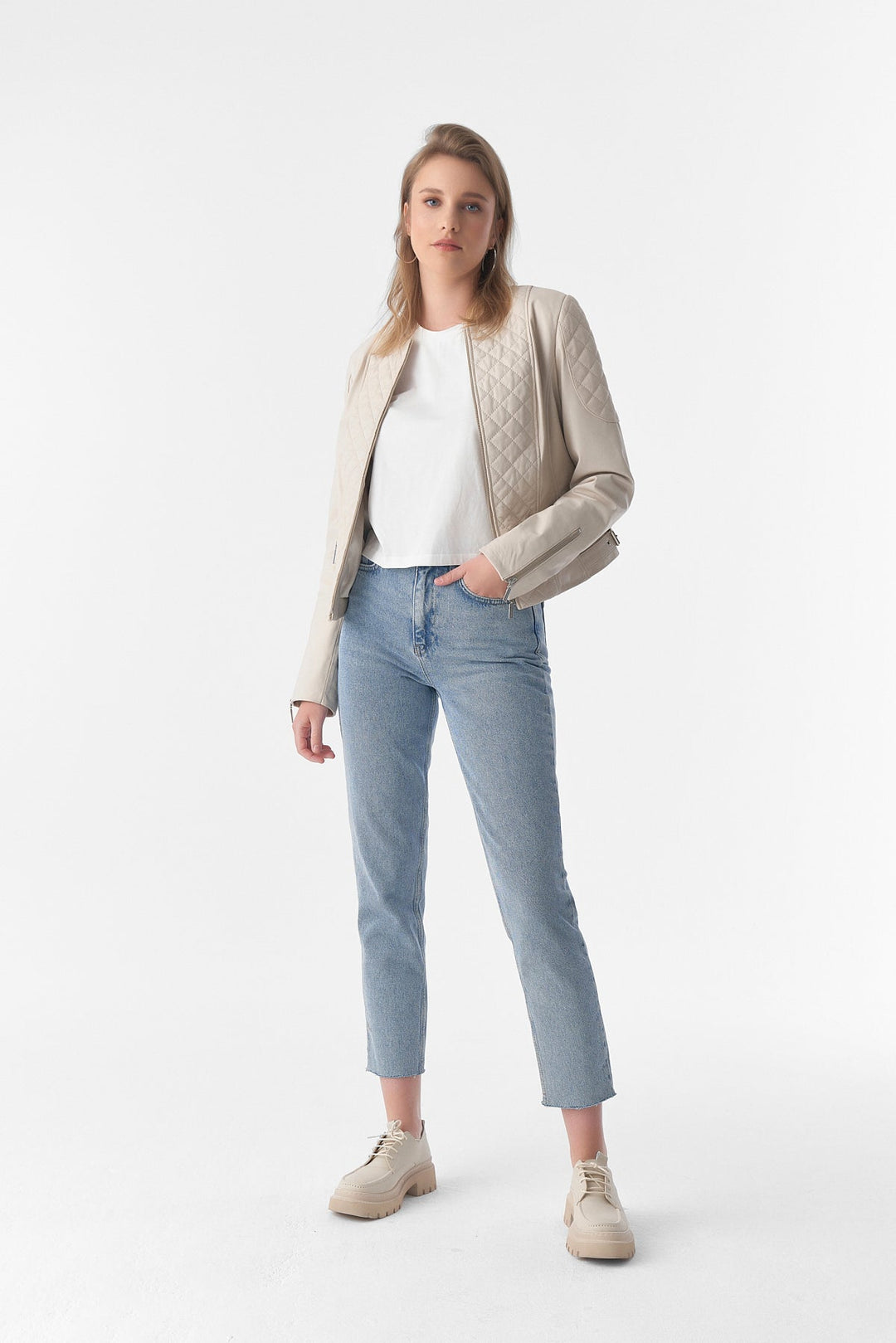 Woman wearing beige leather jacket