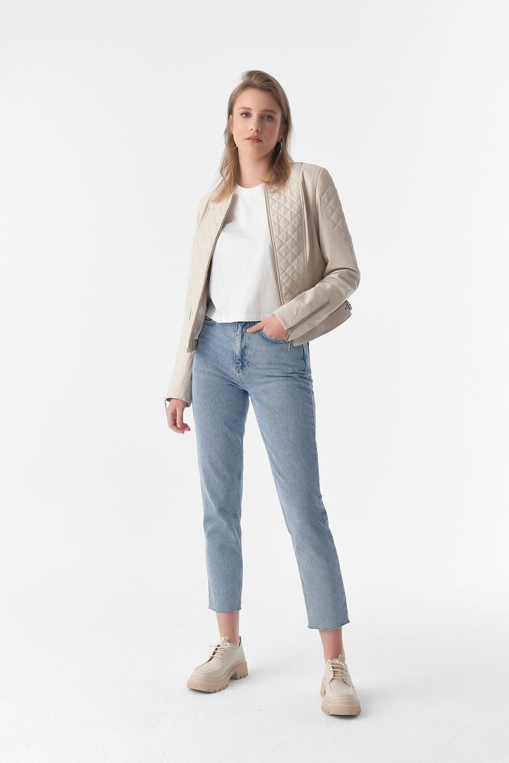 Woman wearing beige leather jacket