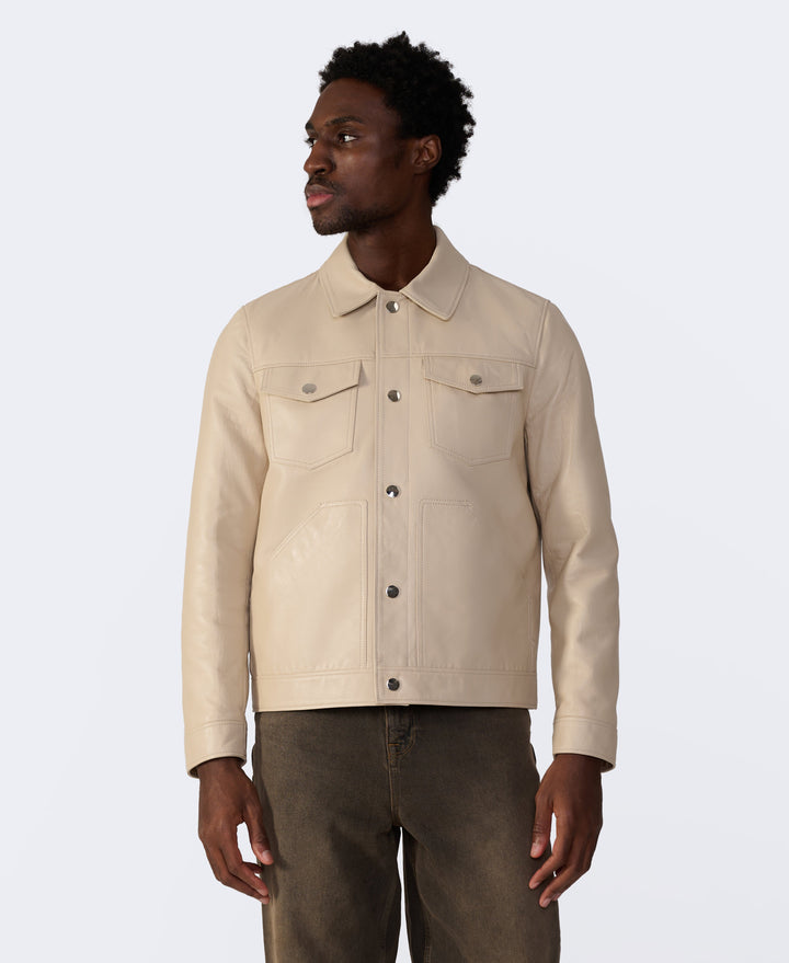 Beige leather trucker jacket on model