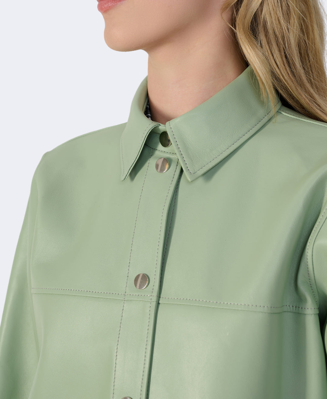 Mint green leather shirt jacket close-up
