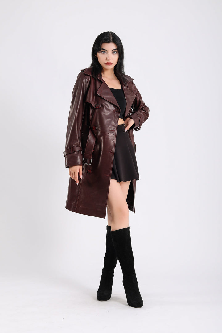 Woman wearing burgundy leather trench coat