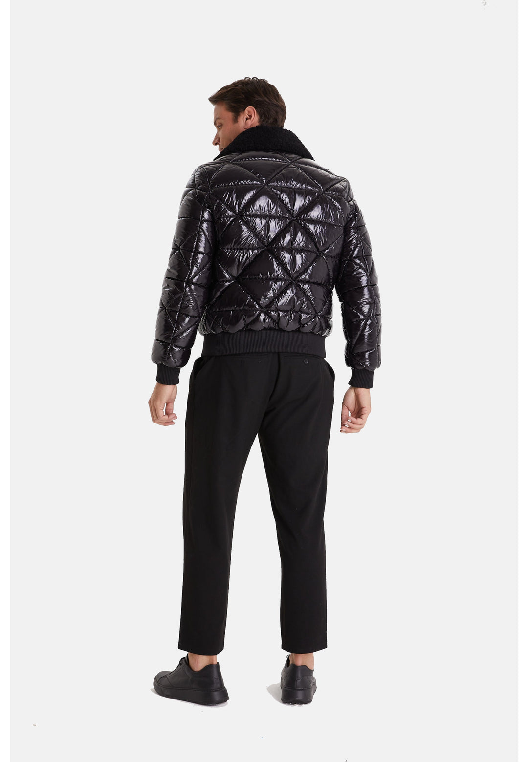 Man wearing black quilted leather jacket