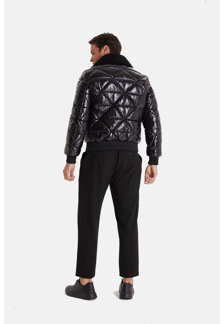 Man wearing black quilted leather jacket