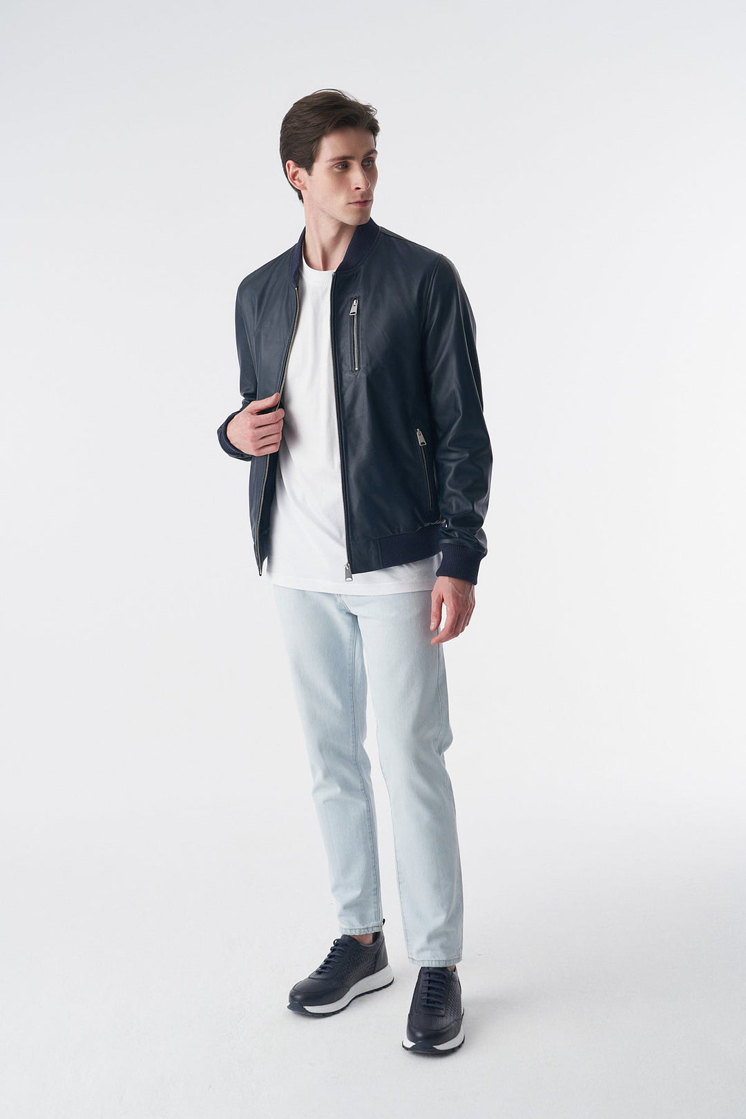 Man wearing blue leather jacket