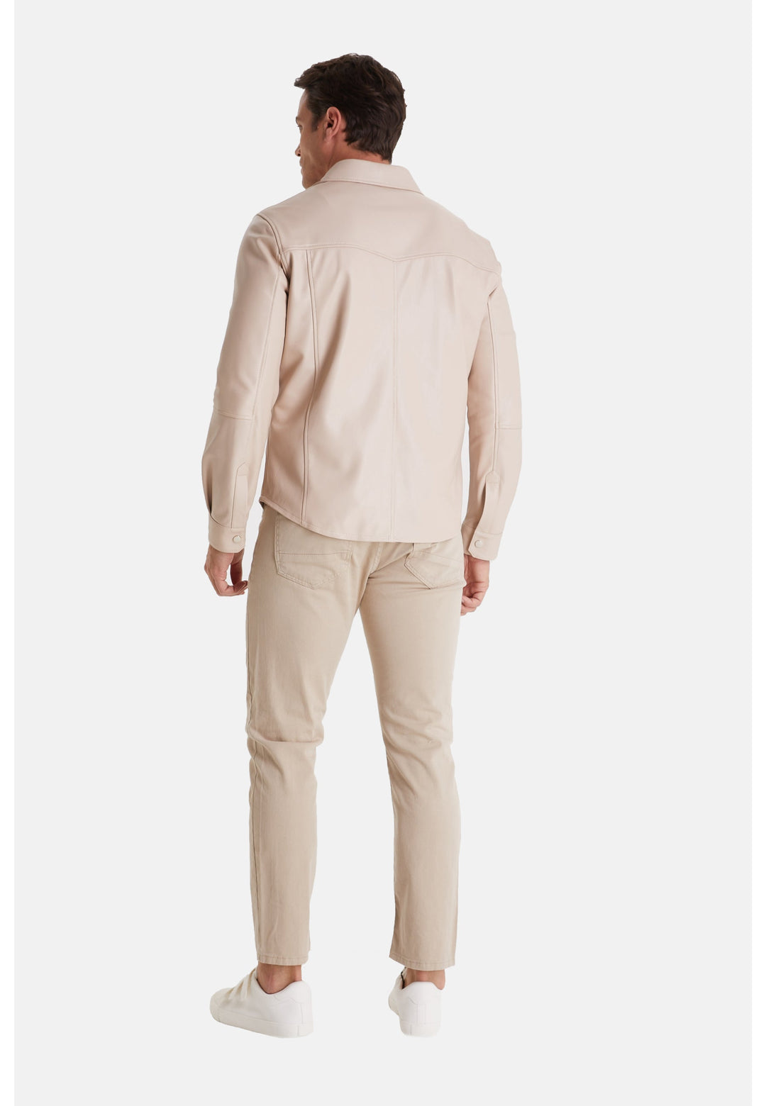 Man wearing beige leather jacket - back view