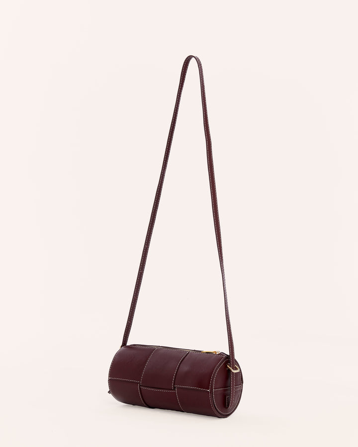Burgundy woven leather barrel handbag