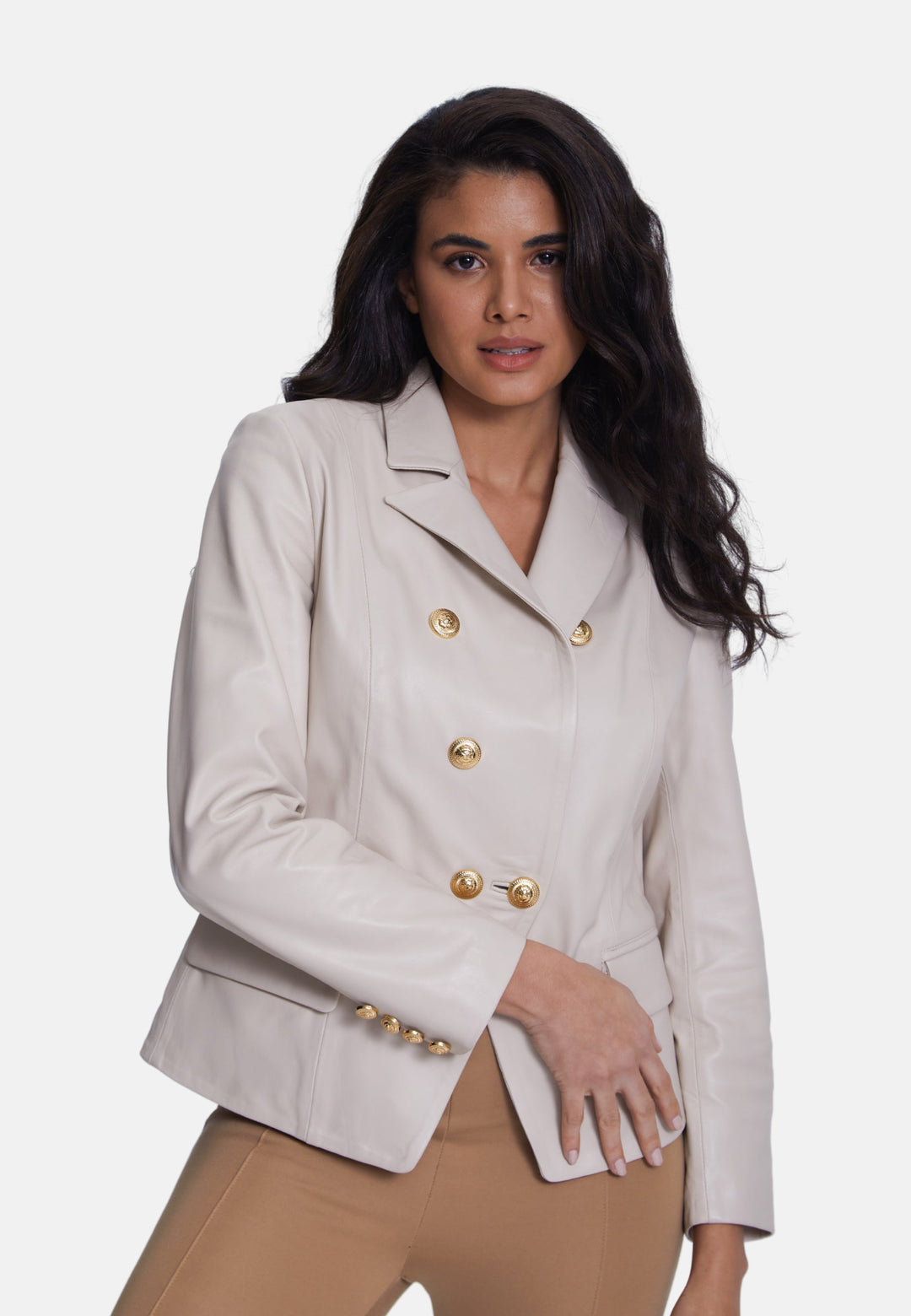 Woman wearing beige leather double-breasted blazer