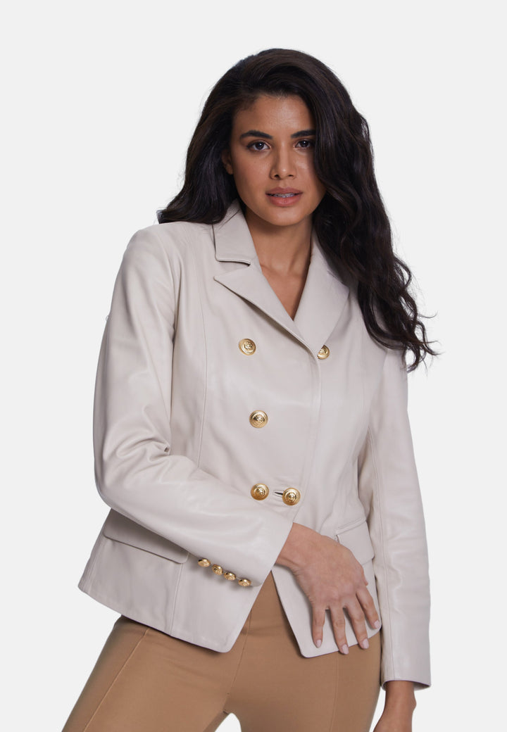 Woman wearing beige leather double-breasted blazer