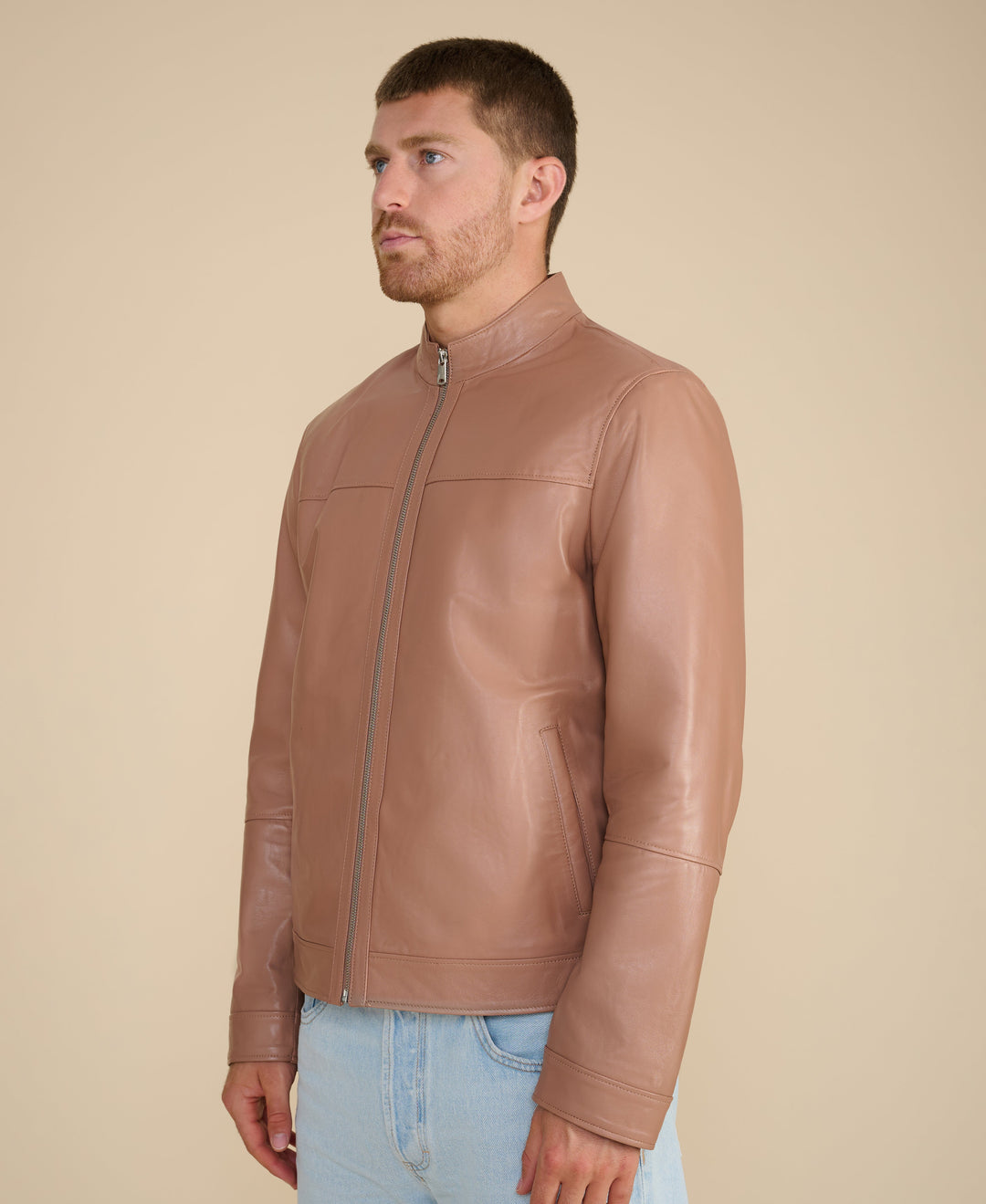 Tan leather racer jacket on model