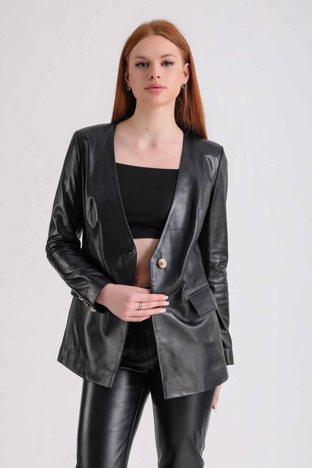 Woman wearing black leather blazer set