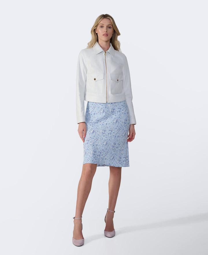 Woman wearing white leather jacket