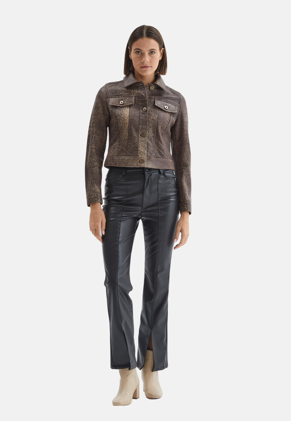 Woman wearing brown cropped leather jacket